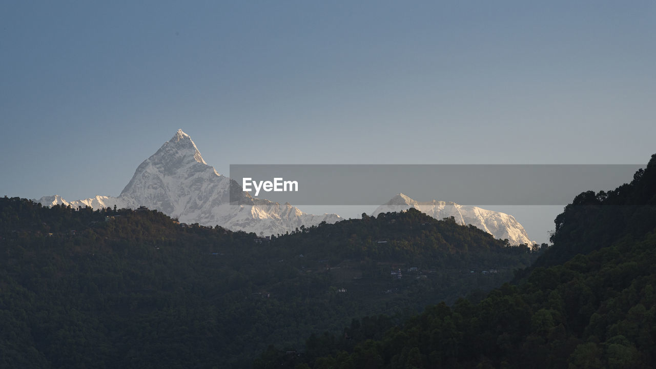 Scenic view of mountains against clear sky