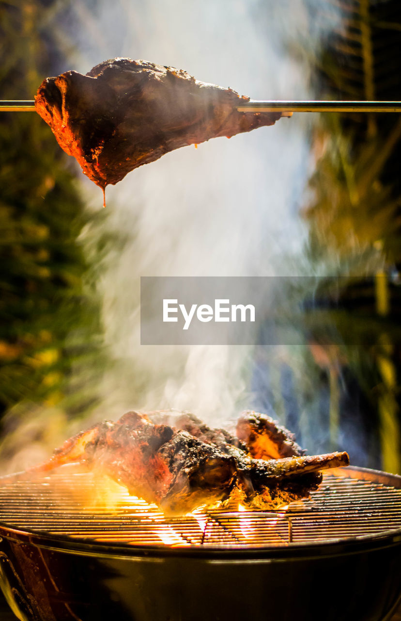 Close-up of meat on barbecue grill