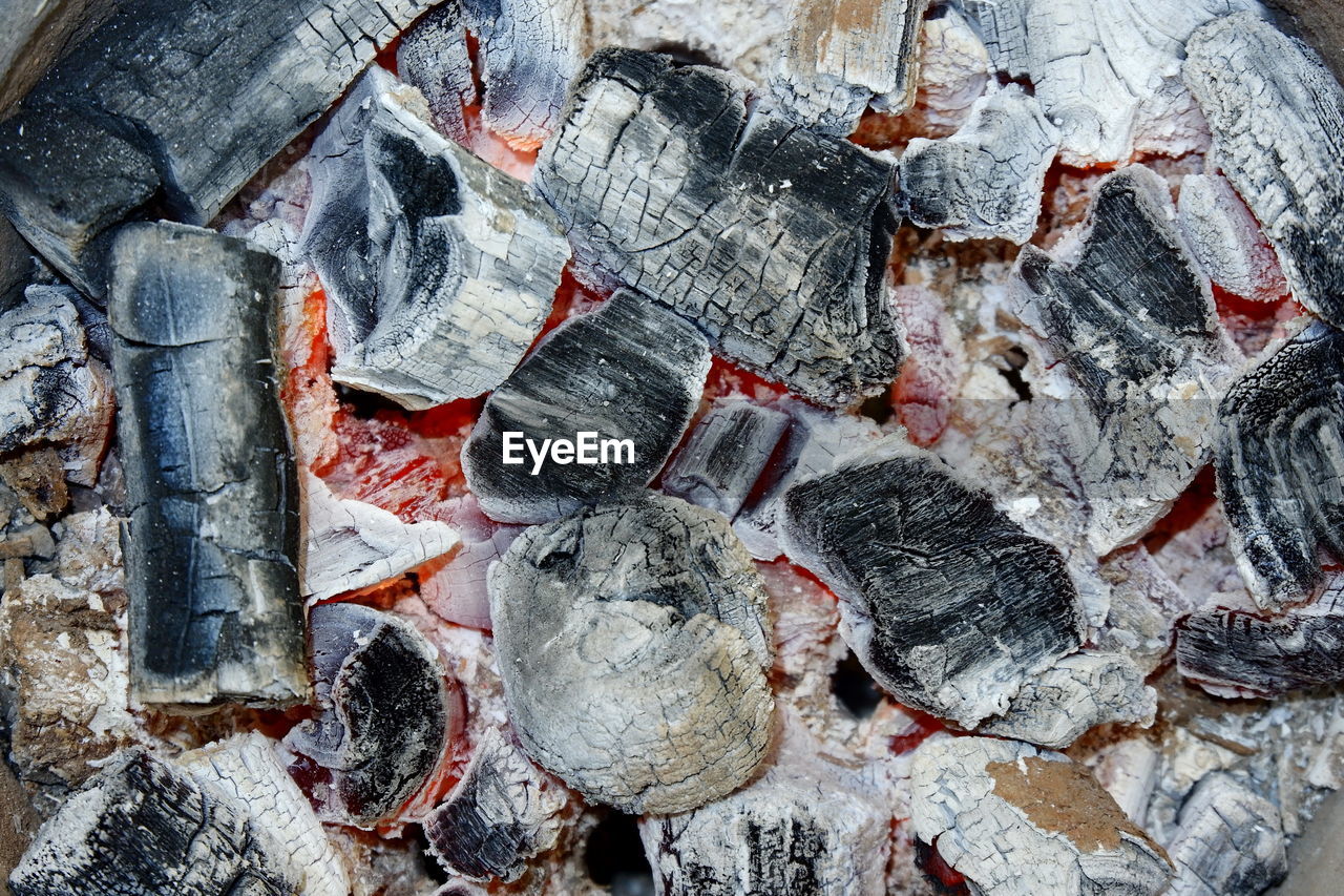 FULL FRAME SHOT OF ROCKS ON SNOW