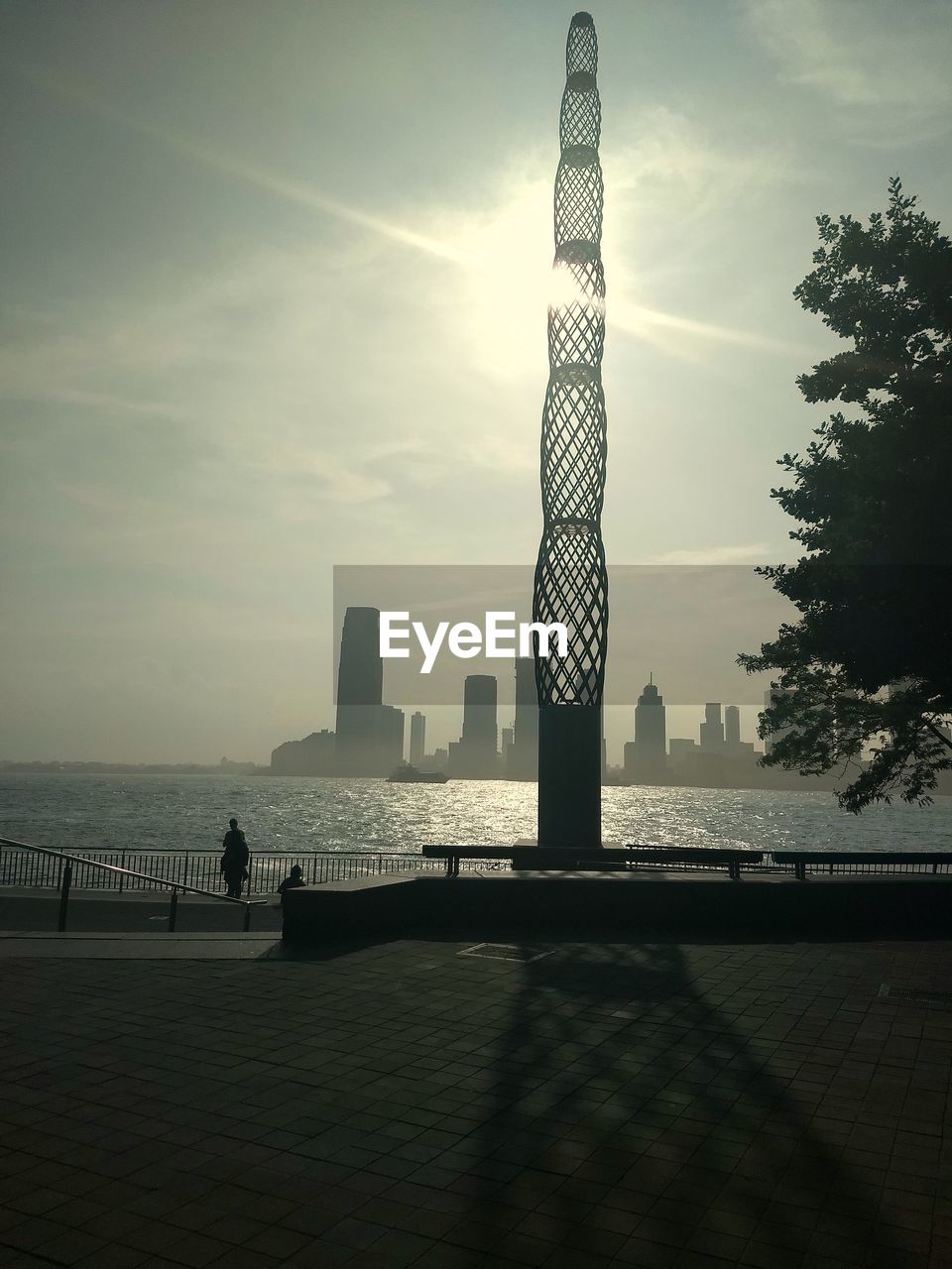 SILHOUETTE OF TOWER AT SEA