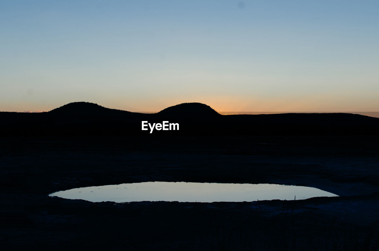 Silhouette of mountain against sky during sunset