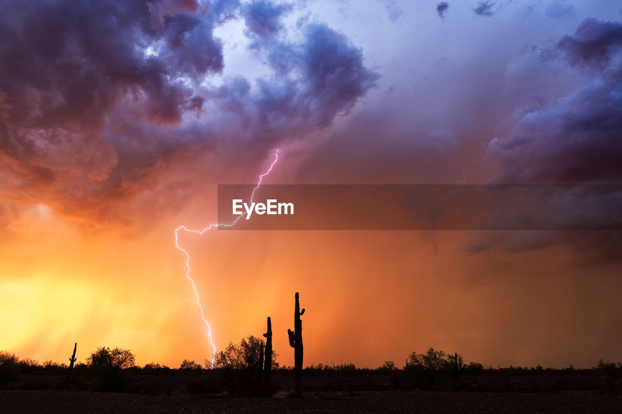 Lightning in sky during sunset