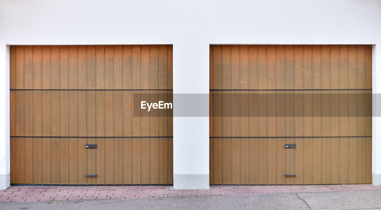Two brown garage roller doors