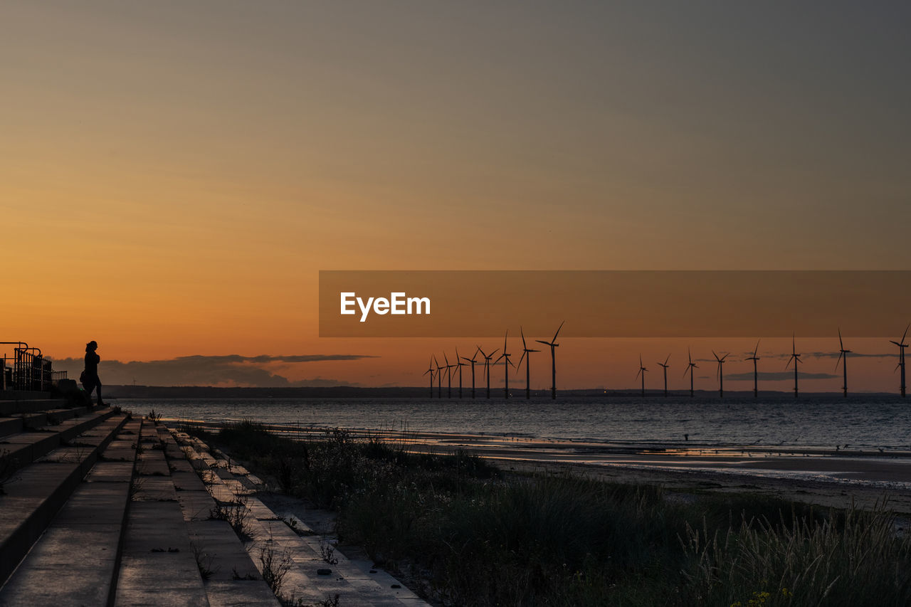 PIER OVER SEA DURING SUNSET