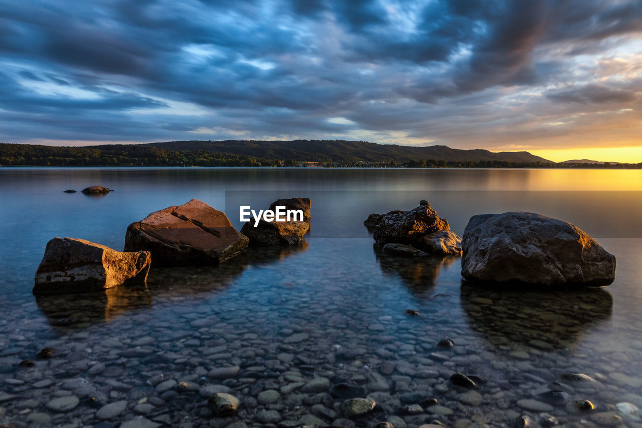 Sunset lake constance with stones