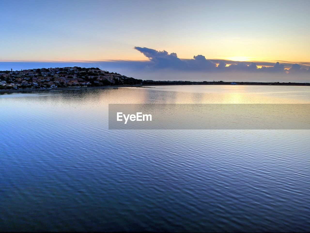 Scenic view of sea against sky at sunset