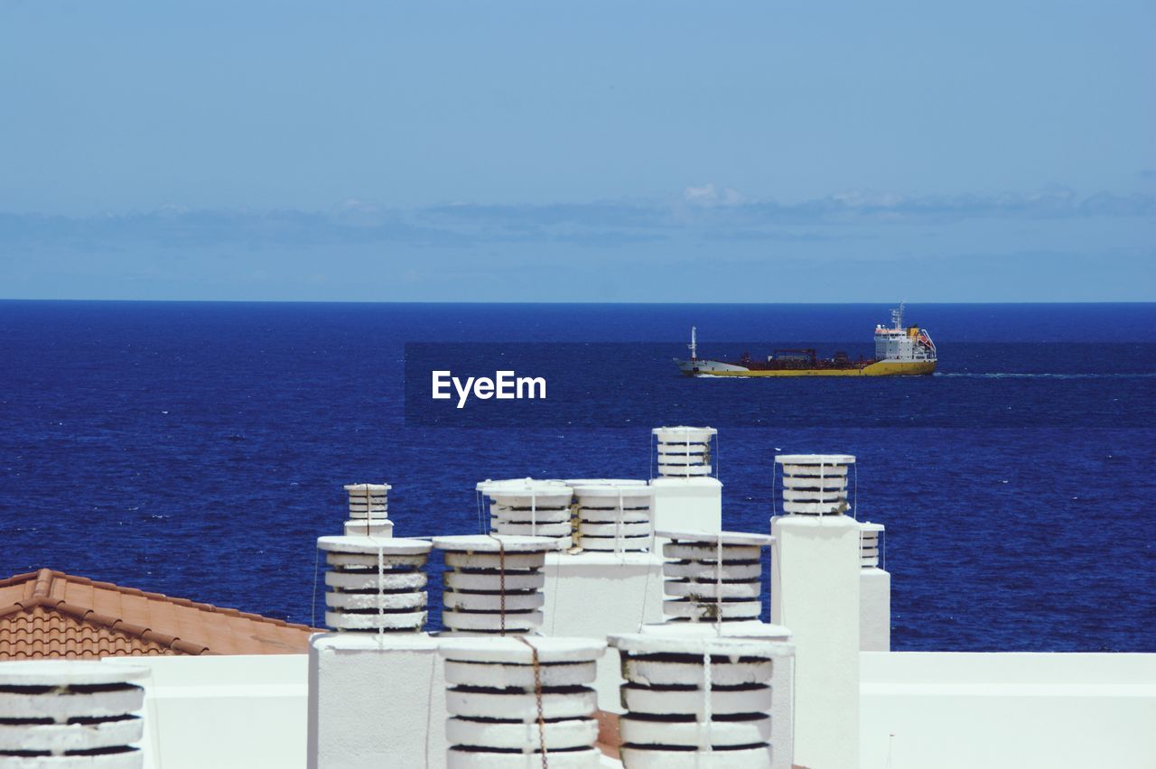 SHIP IN SEA AGAINST SKY