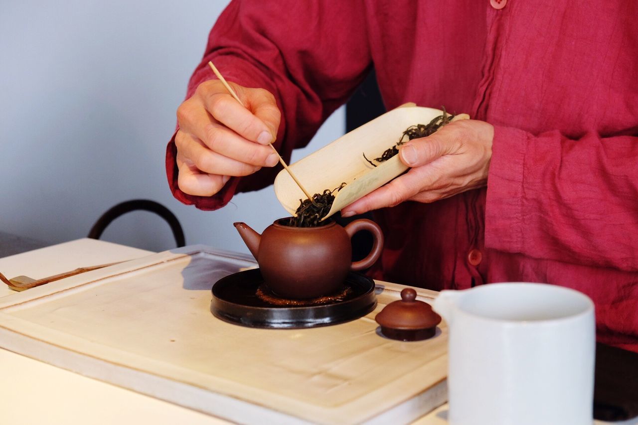 Person preparing tea