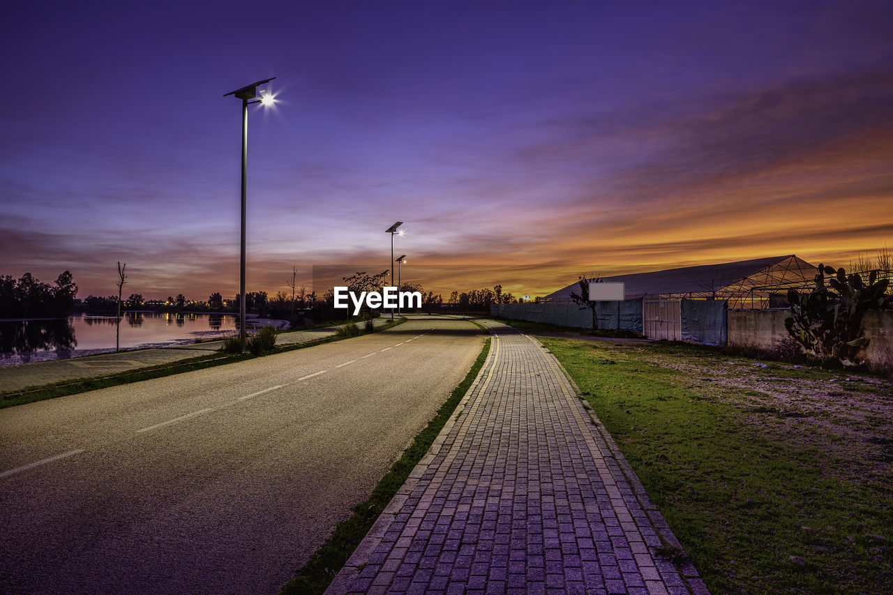 STREET AGAINST SKY AT DUSK