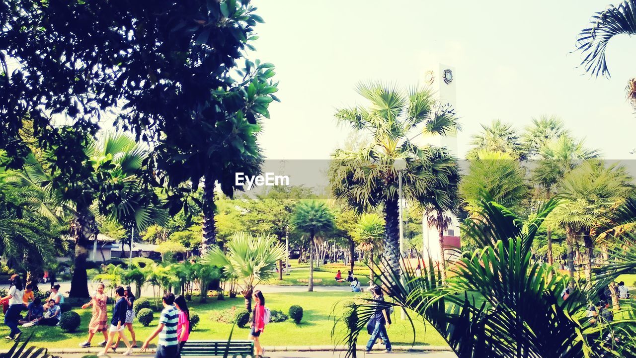 PEOPLE WALKING ON ROAD