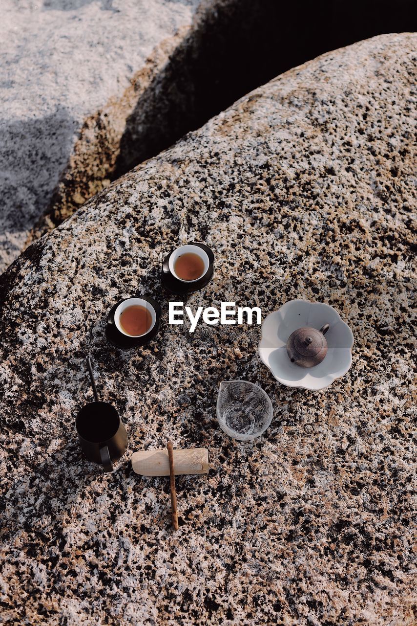 High angle view of tea on rock