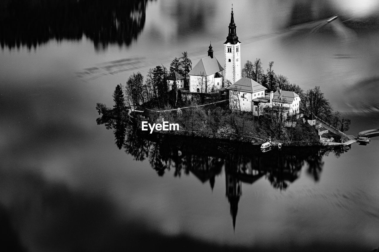 High angle view of church amidst lake