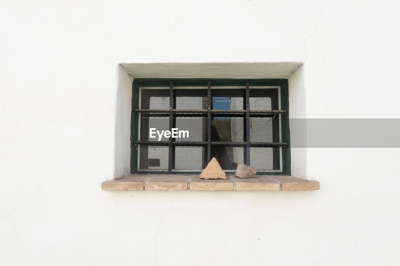 window, architecture, built structure, building exterior, building, wall - building feature, no people, house, wall, day, wood, interior design, glass, residential district, outdoors, home, copy space, low angle view