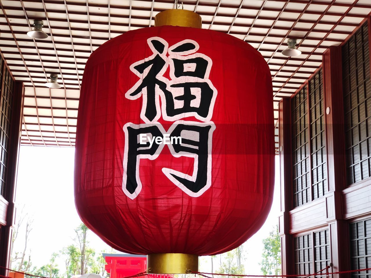 LOW ANGLE VIEW OF LANTERN HANGING BY BUILDING