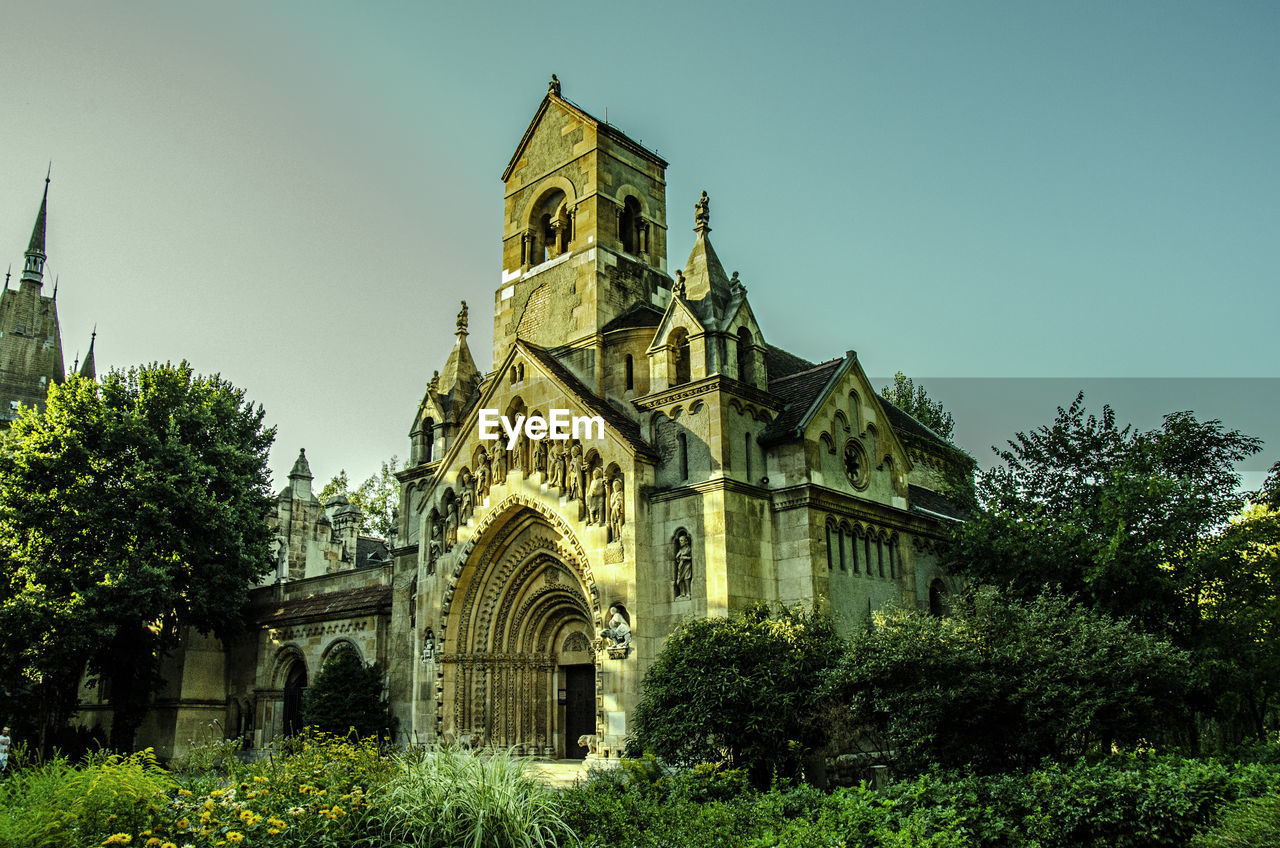 LOW ANGLE VIEW OF CHURCH WITH CHURCH IN BACKGROUND