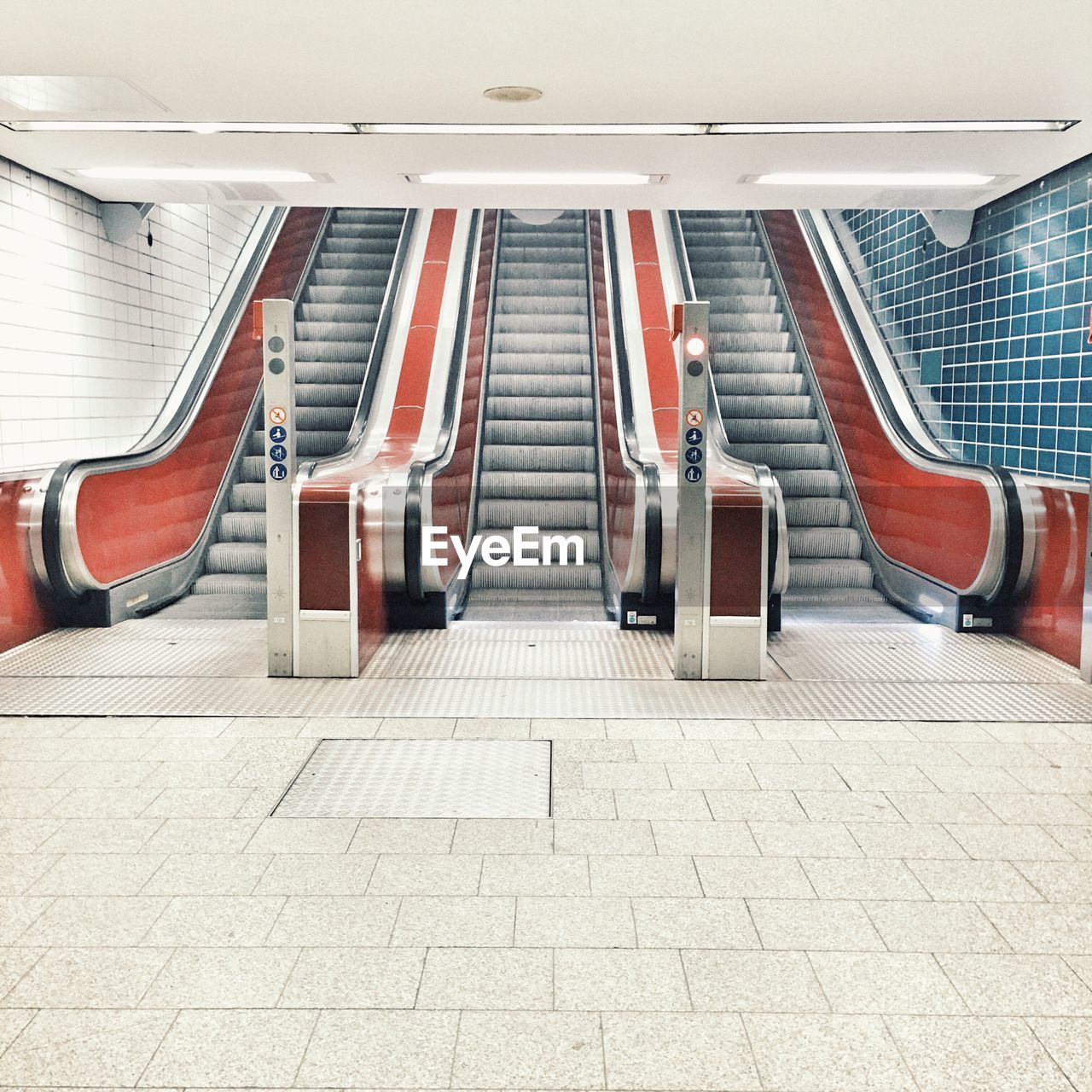 Empty escalators in illuminated railroad station
