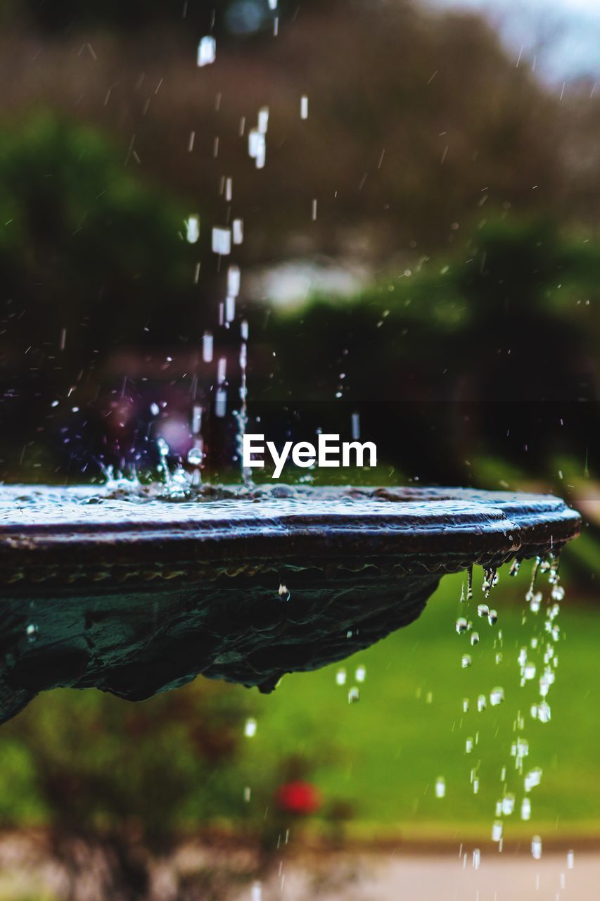 Water splashing in fountain at garden