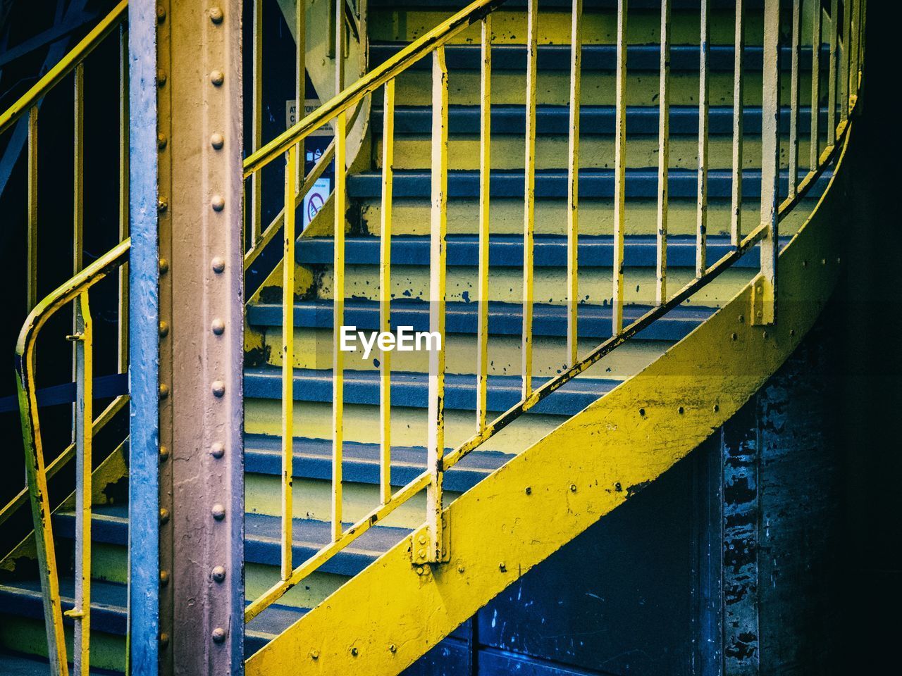 CLOSE-UP OF YELLOW METAL STRUCTURE