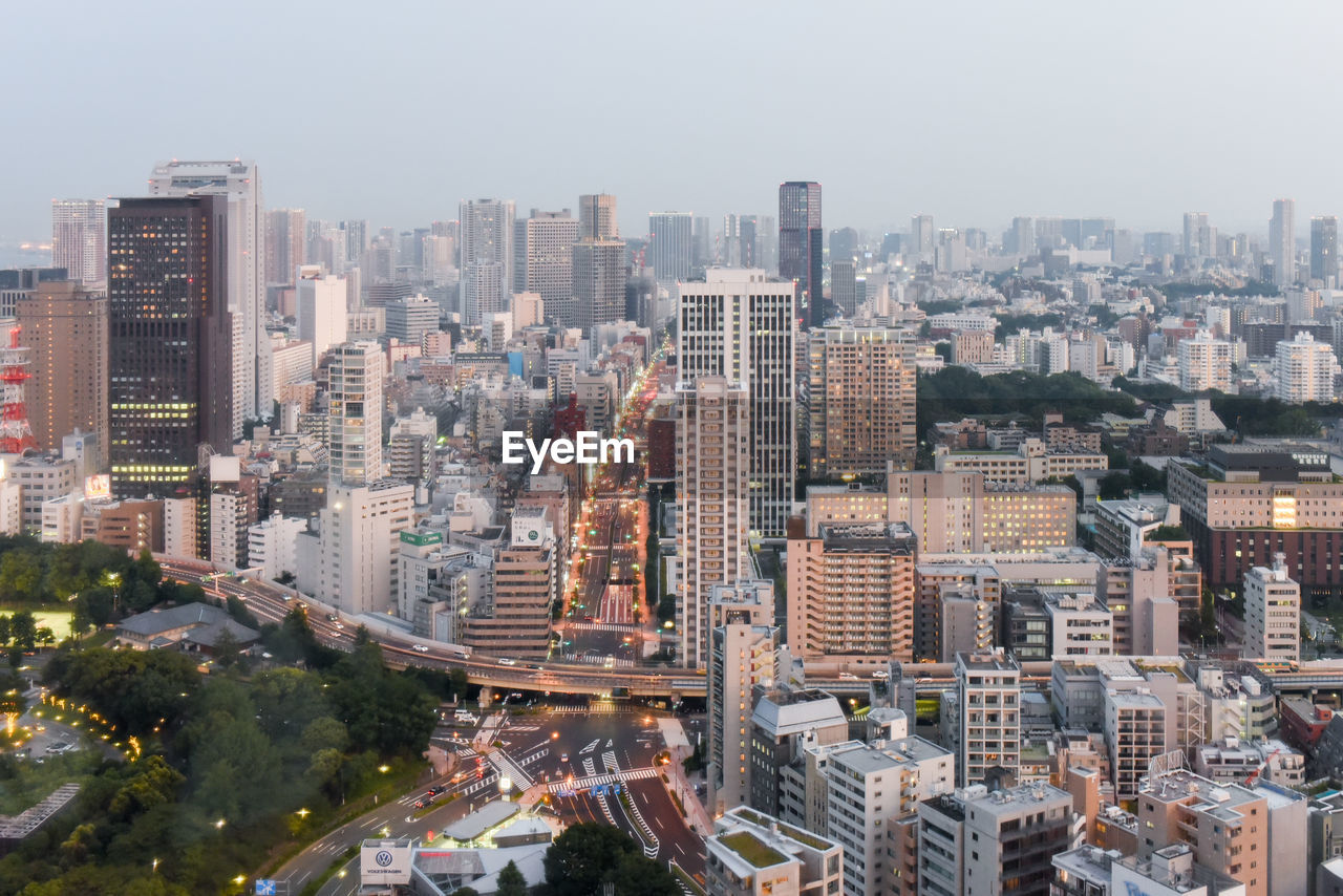 High angle view of modern buildings in city against sky