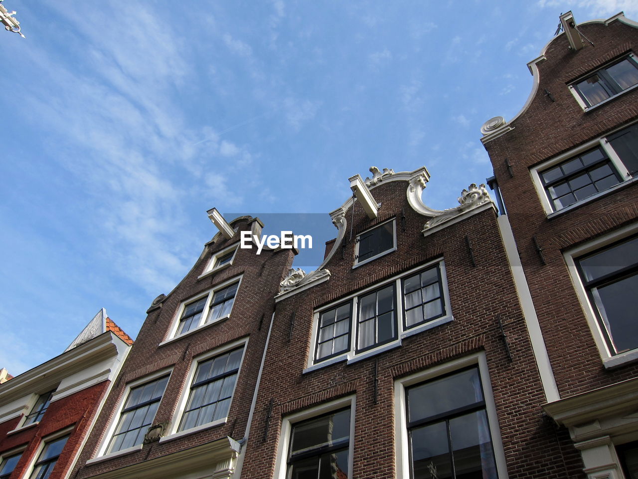 LOW ANGLE VIEW OF BUILDINGS IN TOWN