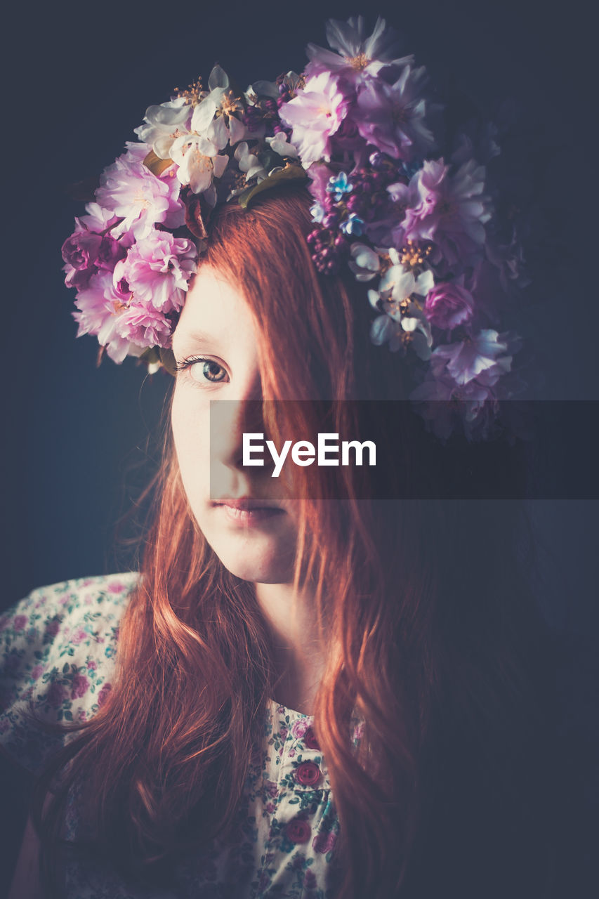 Portrait of girl wearing floral garland