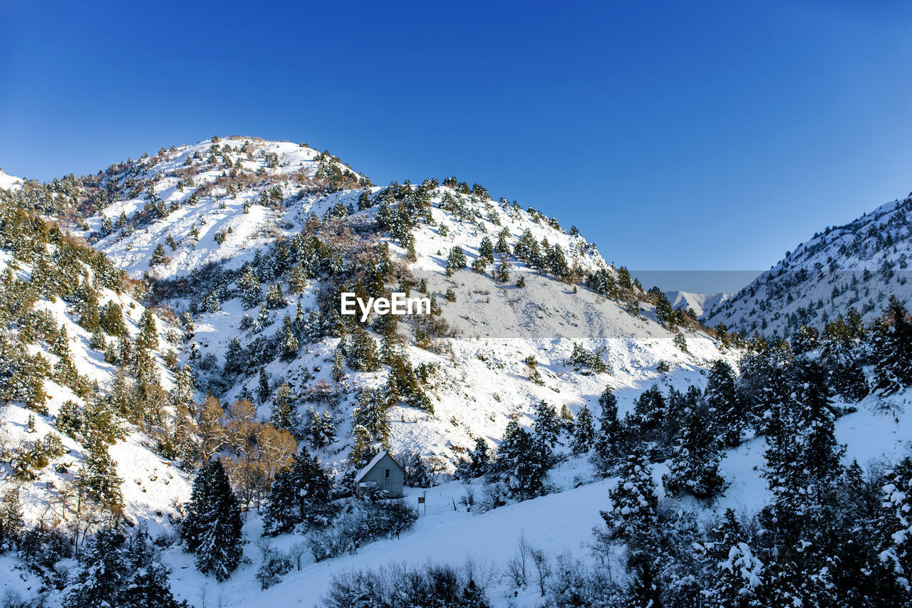 Beautiful mountain peaks covered with snow in the area of beldersay resort in uzbekistan