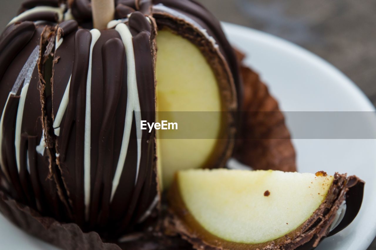 Close-up of chocolate dessert with slice in plate