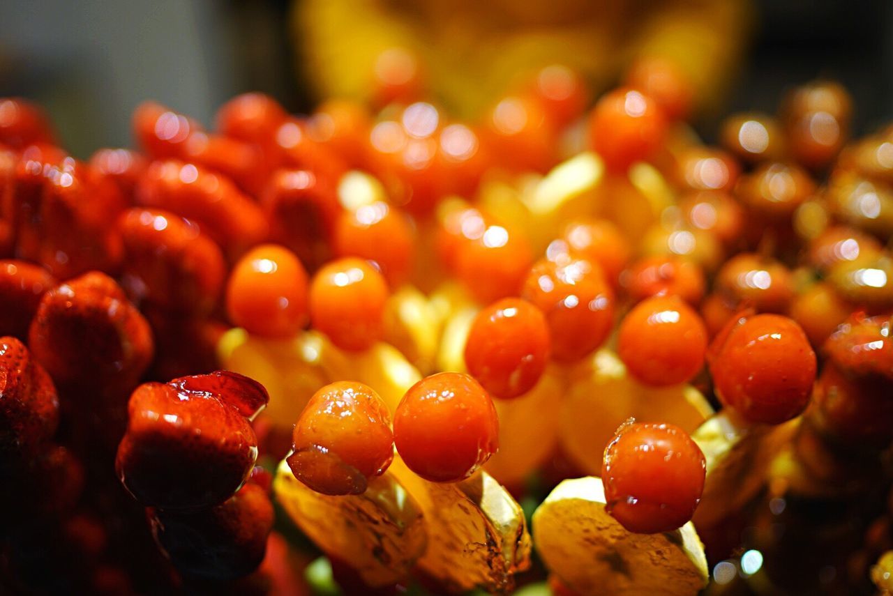 High angle view of fruit skewers displayed at street market