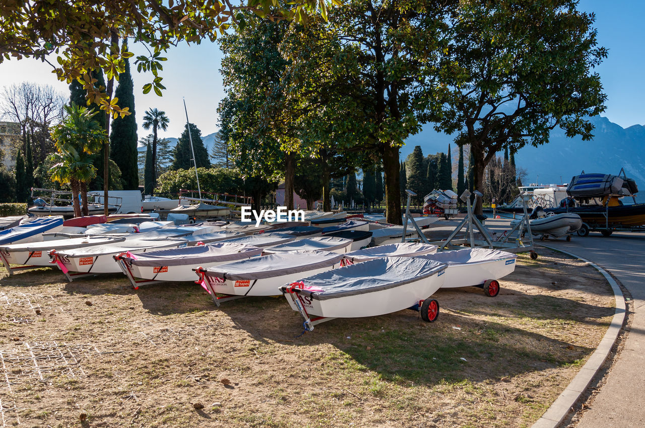 VIEW OF BOATS MOORED ON ROAD