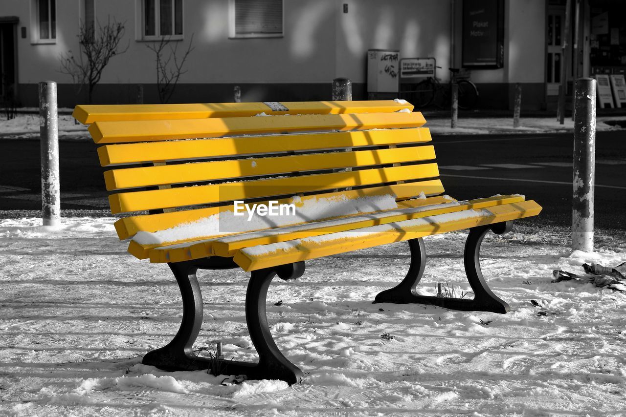 seat, bench, furniture, yellow, snow, empty, no people, architecture, absence, chair, nature, built structure, outdoors, white, day, table, street, wood, building exterior