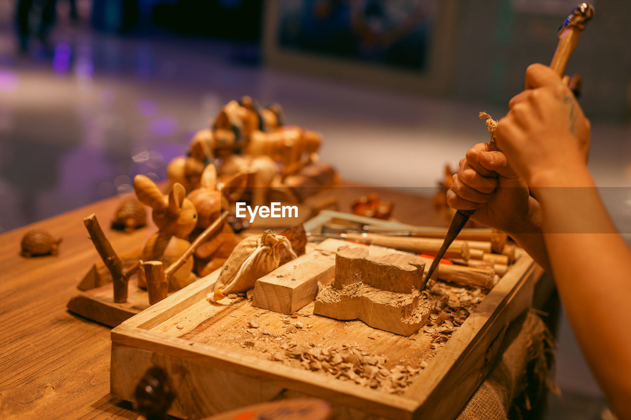 Master at work in a wooden and ceramic crafting shop in the greater bay area