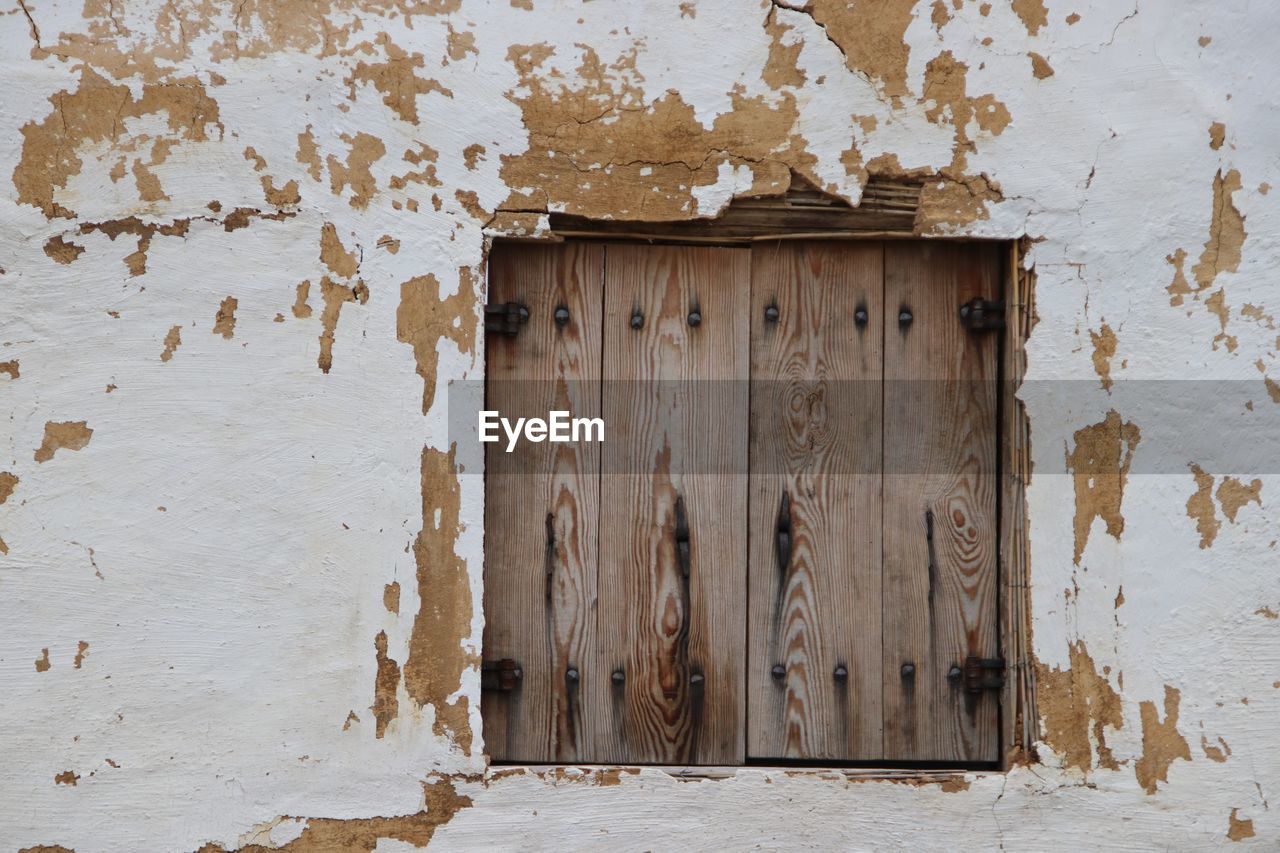 Closed window of old building