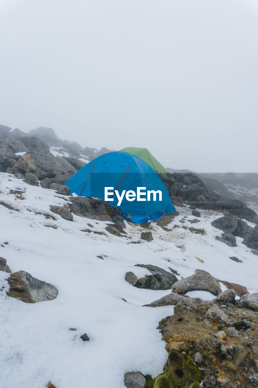 scenic view of snow covered landscape against clear sky