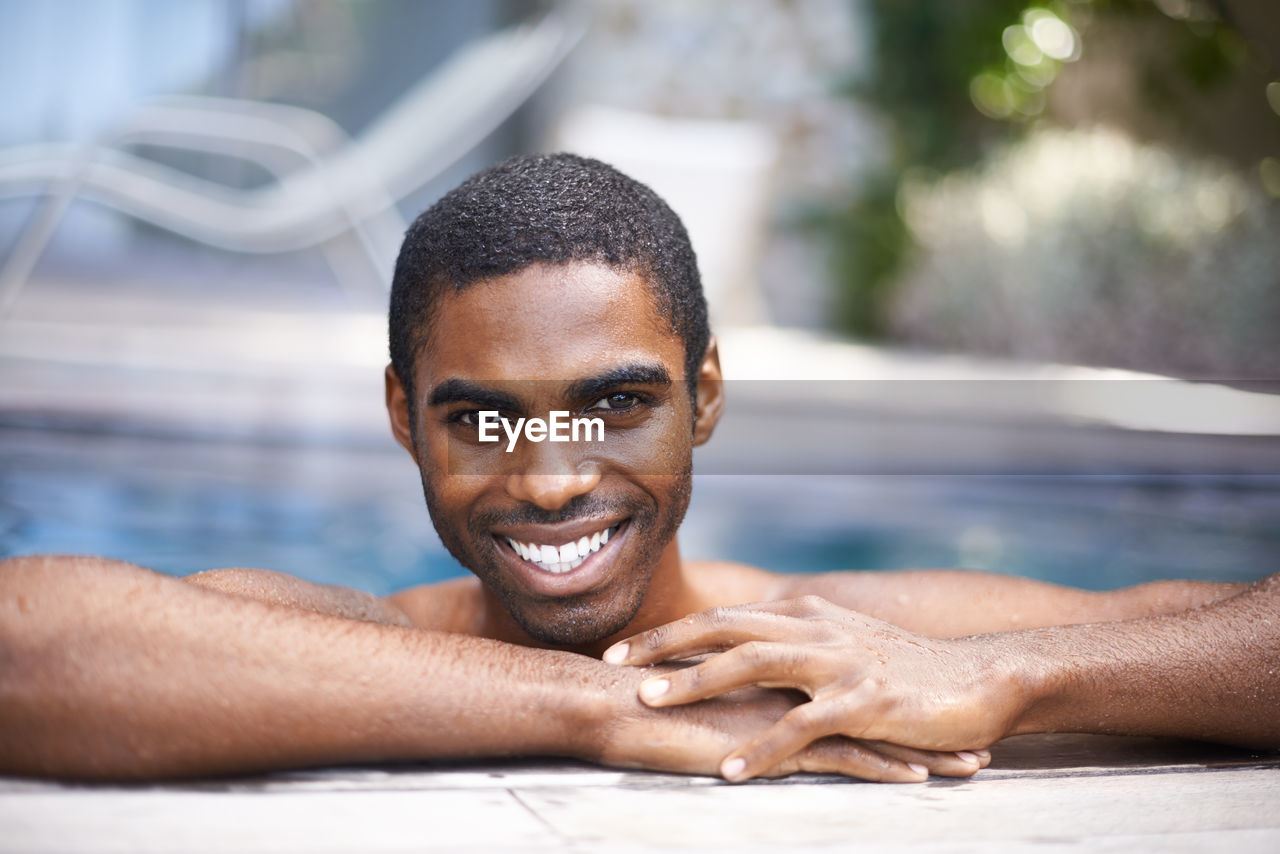 adult, smiling, happiness, portrait, relaxation, lifestyles, emotion, men, cheerful, young adult, water, enjoyment, headshot, human face, person, one person, nature, positive emotion, looking at camera, leisure activity, summer, swimming, wellbeing, teeth, smile, copy space, outdoors, women, holiday, swimming pool, close-up, sunlight