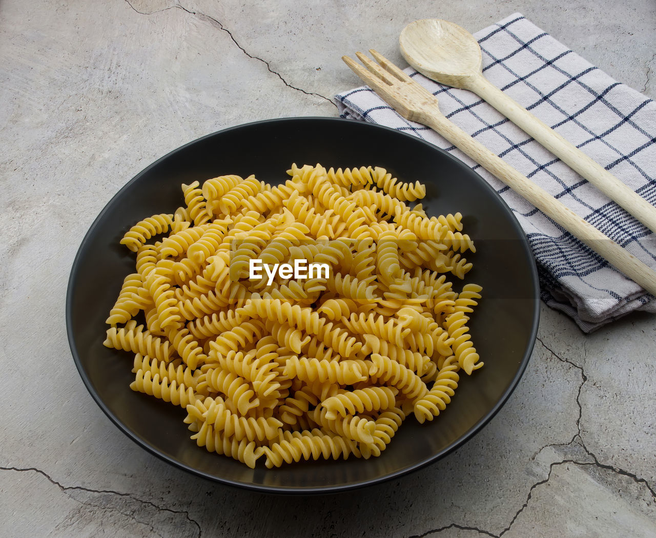 Raw italian fusilli pasta. traditional italian cuisine.