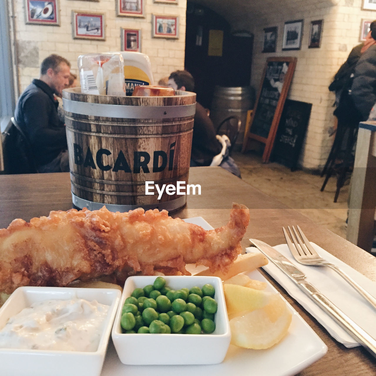 WOMAN EATING FOOD IN TRAY