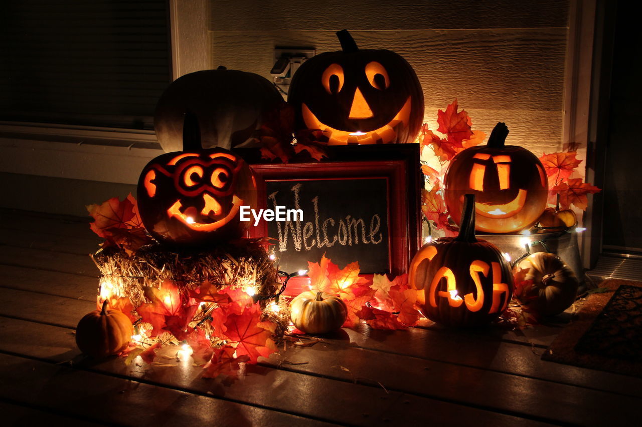 Illuminated jack o lanterns with welcome sign