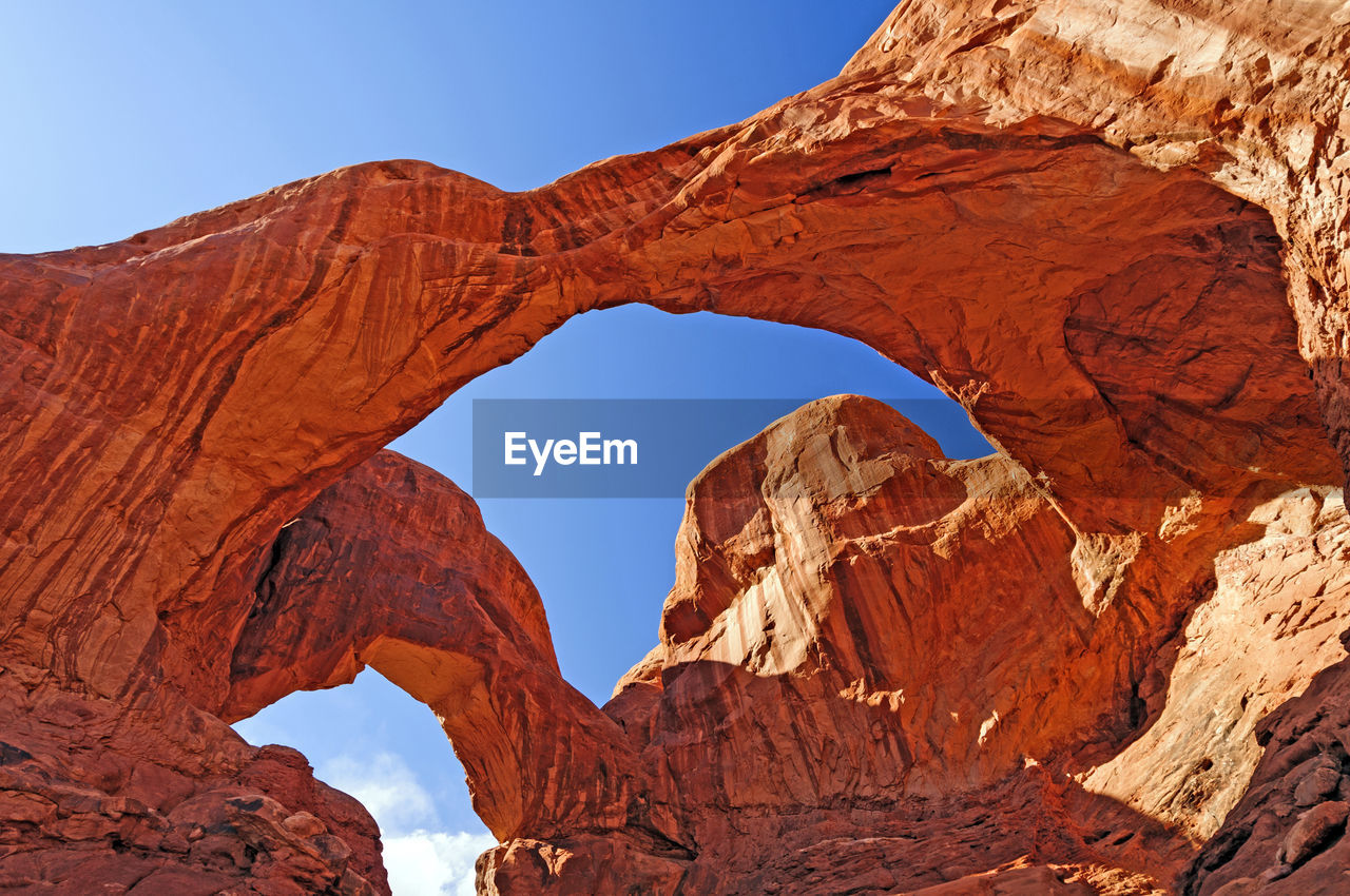 Shade and sun on the double arch in arches national park in utah