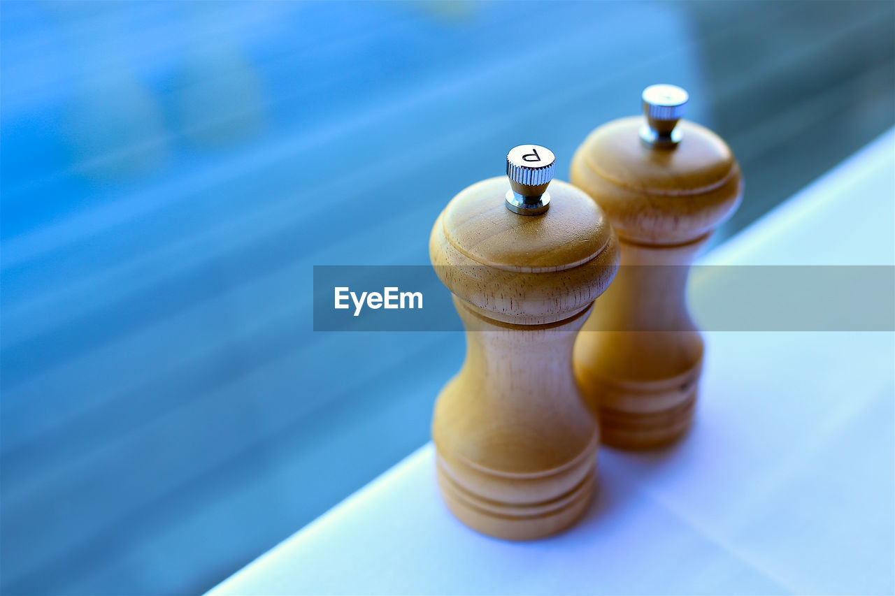 High angle view of salt and pepper shaker on table