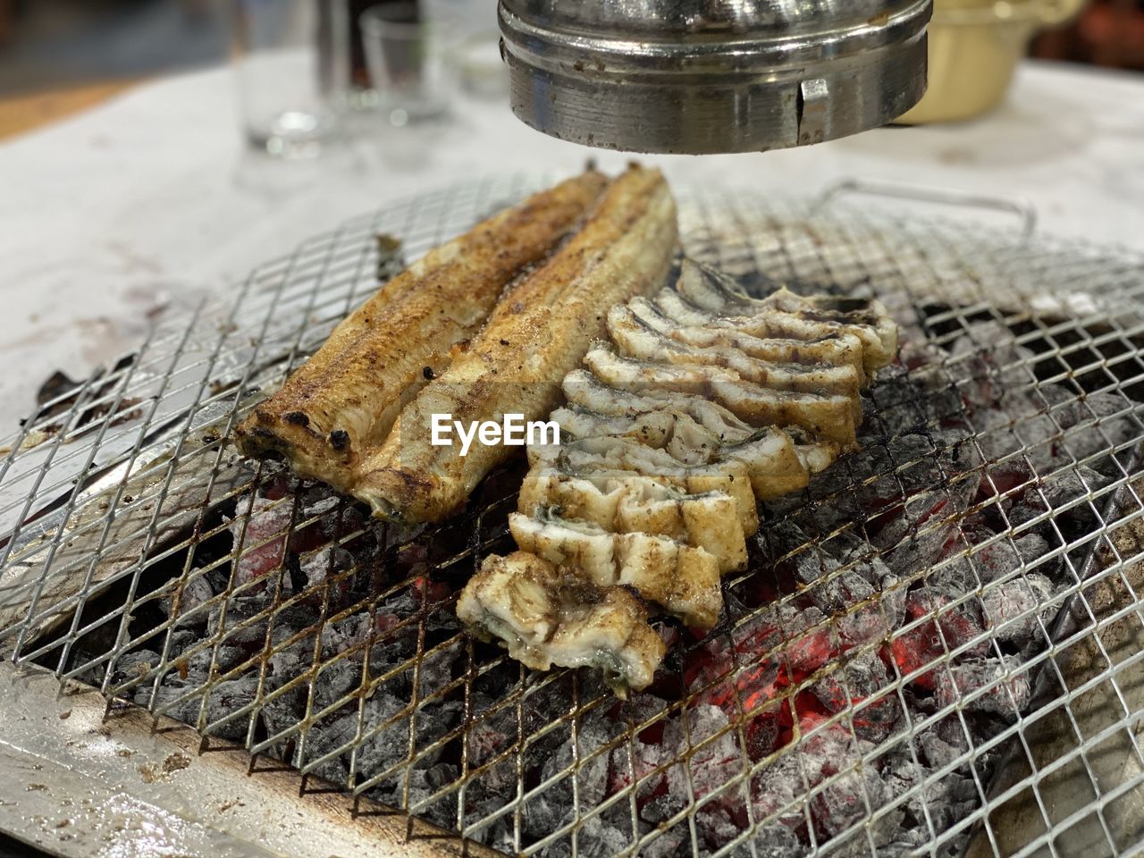 High angle view of meat on barbecue grill