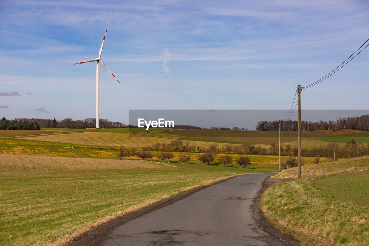 Green energy from wind power requires a power grid and power poles for german energiewende