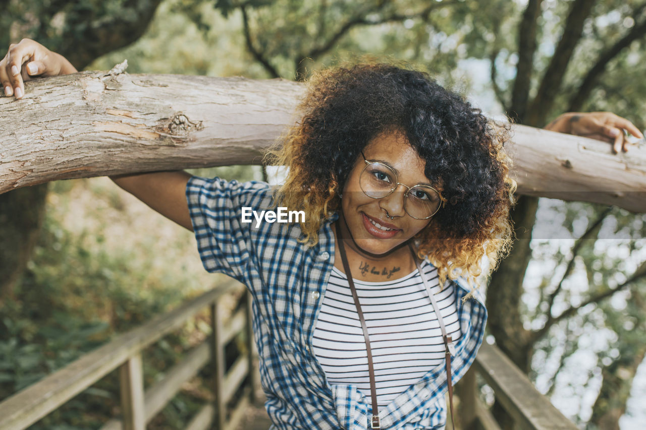 Portrait of young girl of color in the forest