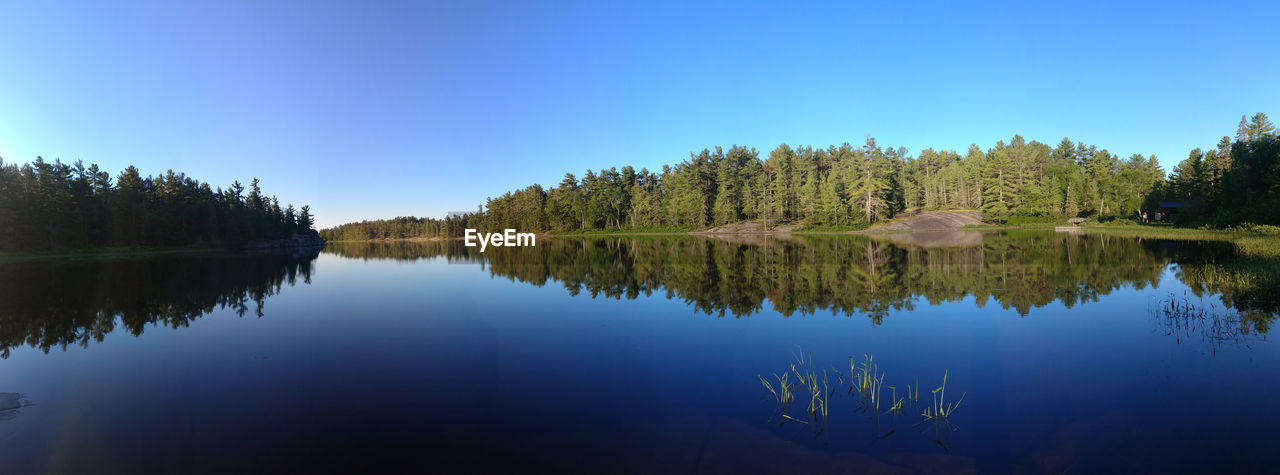 Scenic view of lake against blue sky