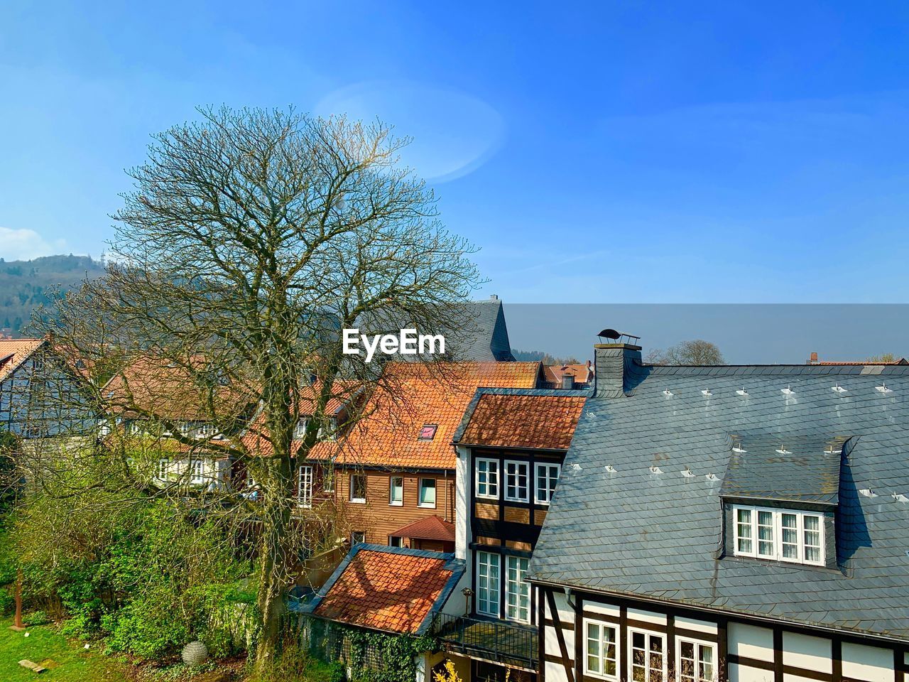 HOUSES IN TOWN AGAINST SKY