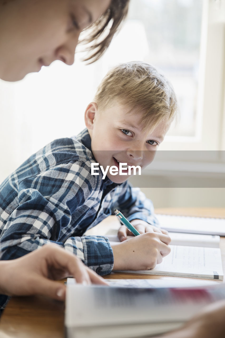 Brothers doing homework