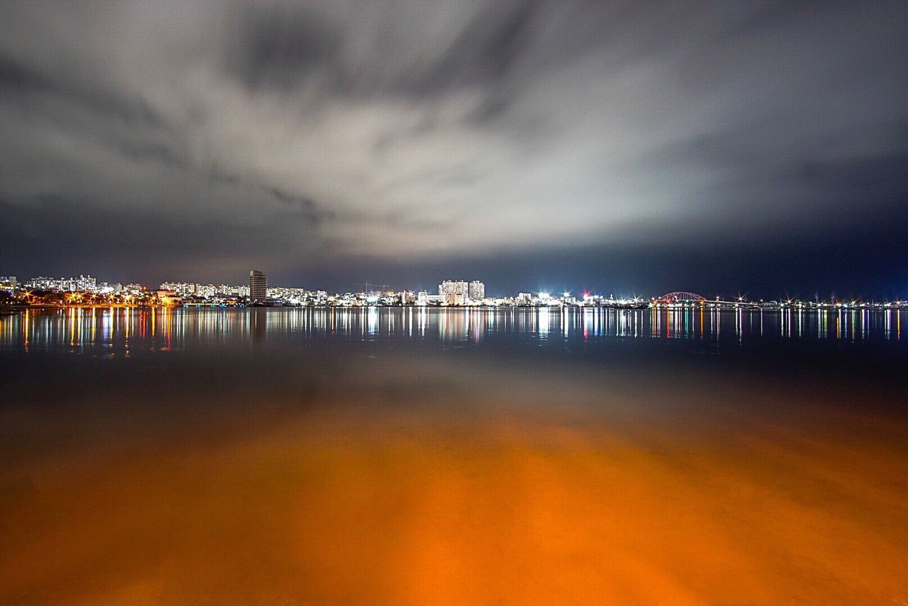 Reflection of clouds in sea at night