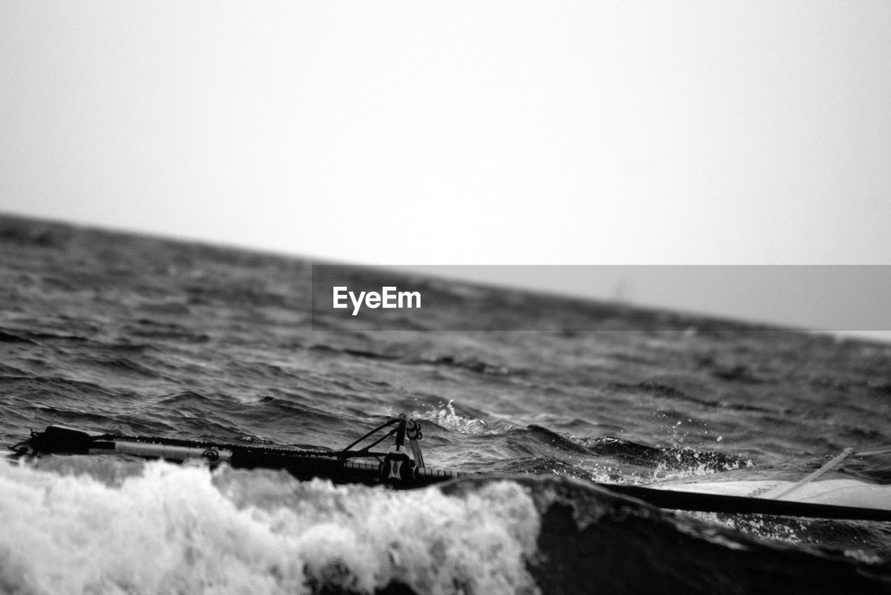 Close-up of surfboard in water