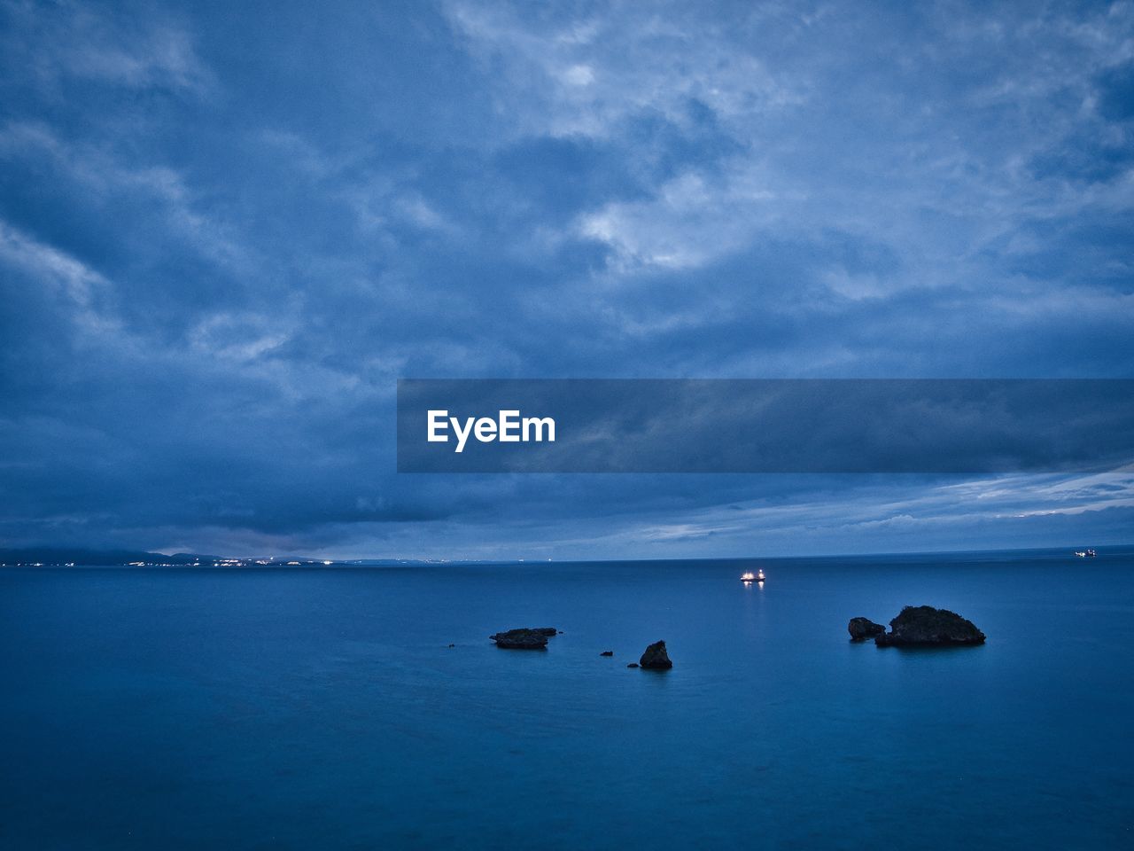 Scenic view of sea against blue sky