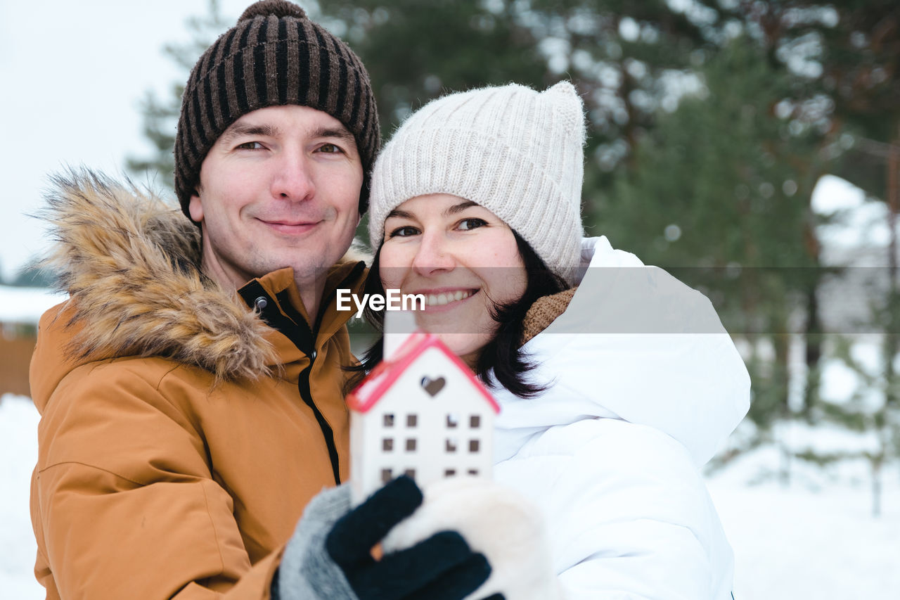 winter, cold temperature, two people, warm clothing, togetherness, clothing, snow, women, smiling, happiness, adult, portrait, emotion, hat, knit hat, love, positive emotion, female, leisure activity, bonding, glove, embracing, looking at camera, men, young adult, nature, cheerful, enjoyment, coat, mitten, fun, day, holiday, affectionate, winter coat, lifestyles, headshot, friendship, vacation, outdoors, trip, romance, standing, knit cap, scarf, winter sports, front view, waist up, tree, frozen, family, child, human face