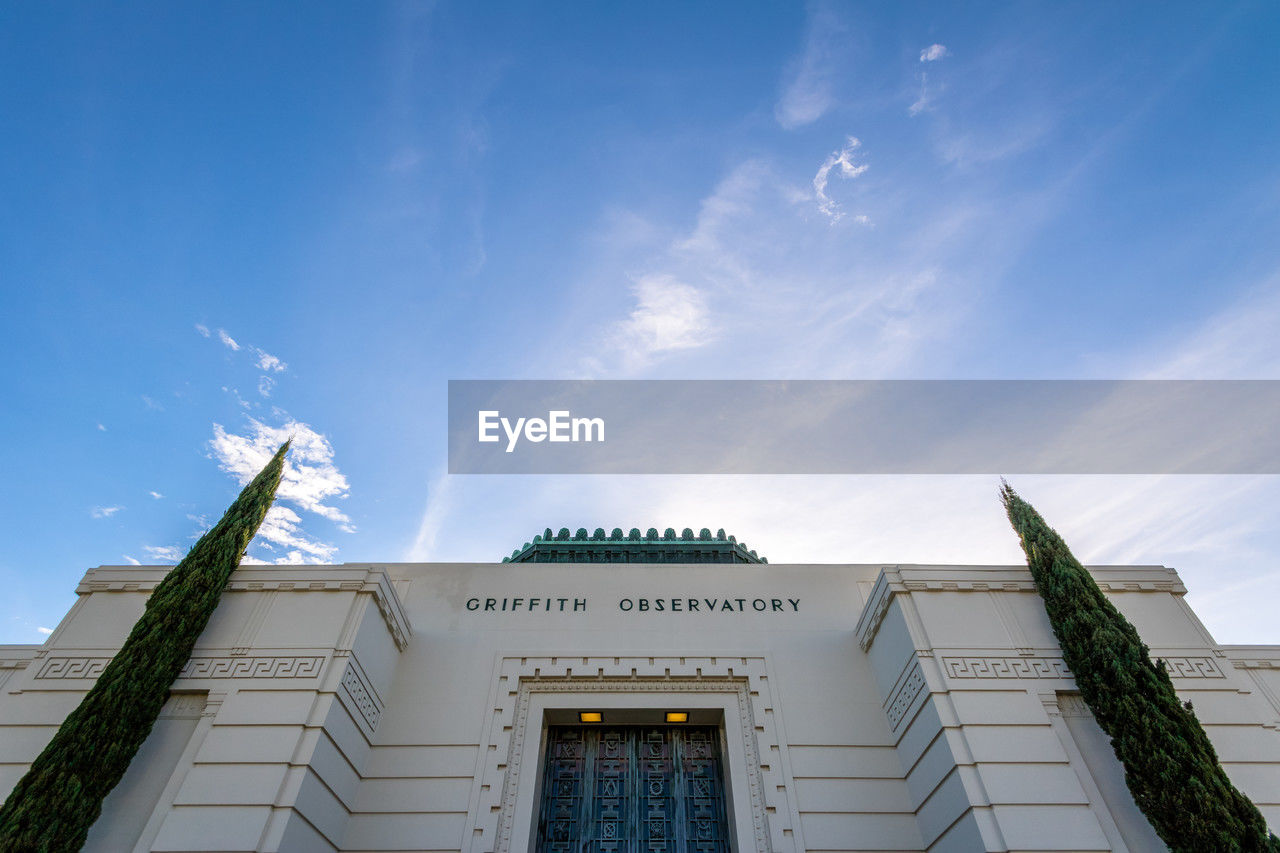 low angle view of built structures against blue sky